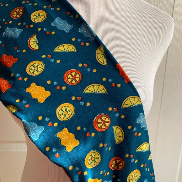 LuLaRoe leggings that have little bears and fruit slices on a teal background! - Picture 1 of 1